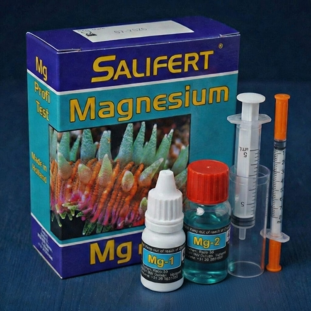 Flat-lay of Salifert Magnesium test kit components: two reagent bottles, two syringes, plastic tip, and test vial on a dark surface